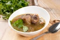 Soup with meat and bone and parsley Royalty Free Stock Photo