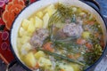 Soup with meat dill potato carrot close up tasty cooking pan