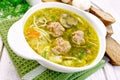 Soup with meatballs and noodles in bowl on green napkin Royalty Free Stock Photo