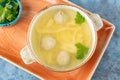Soup with meatballs, noodles and parsley in a white bowl Royalty Free Stock Photo