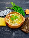 Soup Minestrone in clay bowl on black board Royalty Free Stock Photo