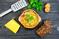 Soup Minestrone in clay bowl on black board top Royalty Free Stock Photo