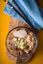 Soup noodle ramen c celery, chicken, daikon in a glass bowl Royalty Free Stock Photo