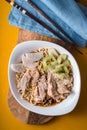 Soup noodle ramen c celery, chicken, daikon on a yellow table Royalty Free Stock Photo