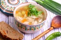 Soup with pelmeni, a potato, carrots submitted with a green onio Royalty Free Stock Photo