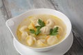 Soup with pelmeni russian dumplings.