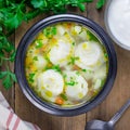 Soup with pelmeni, russian dumplings, top view, square