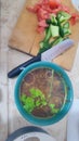 soup in a plate, tomatoes and cucumbers on a board, food lunch cooking Royalty Free Stock Photo