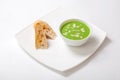 Soup puree of asparagus. Asparagus cream soup in white bowl with slices of white bread Royalty Free Stock Photo