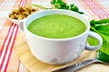Soup puree with spinach on fabric Royalty Free Stock Photo