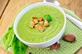 Soup puree of spinach with garlic on board Royalty Free Stock Photo