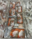 Soup set of salmon heads in supermarket refrigerator. Frozen seafood for sale