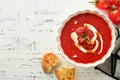 Soup. Tomato cream soup or gazpacho with herbs, seasonings, cherry tomato and parsley in white bowl on light grey stone background Royalty Free Stock Photo