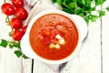 Soup tomato in white bowl with vegetables on board top Royalty Free Stock Photo