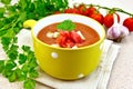 Soup tomato in yellow bowl on towel Royalty Free Stock Photo