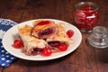 Sour cherry filo pie, candied sour cherries, white plate Royalty Free Stock Photo