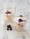 Sour cream in glass with black currants. Royalty Free Stock Photo