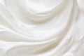 Sour cream, greek yogurt texture. White dairy product swirl closeup