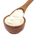 Sour cream in wooden spoon isolated on white background Royalty Free Stock Photo