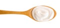 Sour cream in wooden spoon isolated on white background. Top view. Flat lay Royalty Free Stock Photo