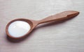 Sour cream in wooden spoon . sauce, yogurt, kefir, milk