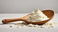 Sour cream in a wooden spoon on a white background. Royalty Free Stock Photo