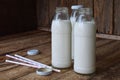 Sour-dairy drink or yoghurt in bottle that come from the kefir grains and milk on wooden background. Photographed with natural lig Royalty Free Stock Photo