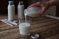 Sour-dairy drink or yoghurt in bottle that come from the kefir grains and milk on wooden background. Photographed with natural lig Royalty Free Stock Photo