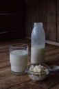 Sour-dairy drink or yoghurt in bottle that come from the kefir grains and milk on wooden background. Photographed with natural lig Royalty Free Stock Photo