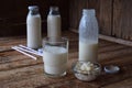 Sour-dairy drink or yoghurt in bottle that come from the kefir grains and milk on wooden background. Photographed with natural lig Royalty Free Stock Photo