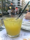 Sour double portion lemonade with ice on a cafe`s table, close up