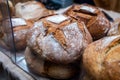 Sour dough bio bread made with natural yeast starter and baked in wood stove on market in France Royalty Free Stock Photo