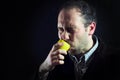 Sour lemon expression sucking man in black Royalty Free Stock Photo