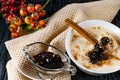 Sour-milk yogurt dessert, with thermostatic cooking, decorated with ripe cherry berries in syrup, on a dark background with jam in Royalty Free Stock Photo