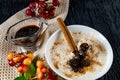 Sour-milk yogurt dessert, with thermostatic cooking, decorated with ripe cherry berries in syrup, on a dark background with jam in Royalty Free Stock Photo