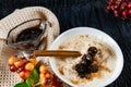 Sour-milk yogurt dessert, with thermostatic cooking, decorated with ripe cherry berries in syrup, on a dark background with jam in Royalty Free Stock Photo