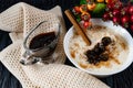 Sour-milk yogurt dessert, with thermostatic cooking, decorated with ripe cherry berries in syrup, on a dark background with jam in