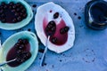 Spoonful of sour Morello cherries on vintage ceramic platter