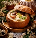 The Sour soup made of rye flour with sausage and eggs served in bread bowl. Traditional easter polish sour rye soup Royalty Free Stock Photo