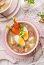 The sour soup ÃÂ»urek, polish Easter soup with the addition of sausage, hard boiled egg and vegetables in a ceramic bowl. Royalty Free Stock Photo