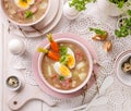 The sour soup ÃÂ»urek, polish Easter soup with the addition of sausage, hard boiled egg and vegetables in a ceramic bowl. Royalty Free Stock Photo