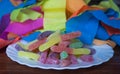 Sour worms confectionery sweet treats with party streamers Royalty Free Stock Photo