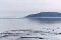 source of the Angara River in the village of Listvyanka. Lake Baikal spring, the time of melting ice.