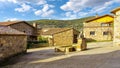 Source of fresh mountain water in the square of the old stone village, Spain. Royalty Free Stock Photo