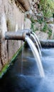 Source of three pipes with crystal clear water Royalty Free Stock Photo