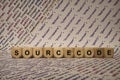 Sourcecode - cube with letters and words from the computer, software, internet categories, wooden cubes Royalty Free Stock Photo
