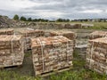 Sourcing red brick from demolition. Stacks of bricks prepared for sale