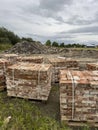 Sourcing red brick from demolition. Stacks of bricks prepared for sale