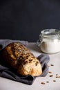 Sourdough artisan bread with pumpkin seeds on a towel.