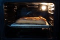 Sourdough bread baking in the oven Royalty Free Stock Photo